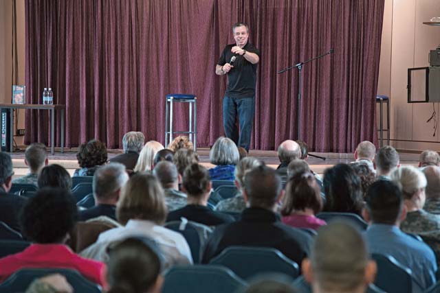 Martin GreesonComedian Bernie McGrenahan delivers a powerful message to service members and civilians during a stand-up comedy performance April 18 at the Patch Community Club. McGrenahan developed “Happy Hour -- Comedy is the Cure,” a show that combines comedy and his own life experiences, to inspire service members. The program was sponsored by U.S. Army Garrison Stuttgart’s Army Substance Abuse Program.