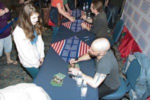 Photo by Greg JonesMembers of the band Daughtry signed autographs after their impromptu concert for service members, civilians and their families March 17 in the Patch Community Club.