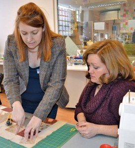 Photo by S.J. GradyKelly Sarles, the Arts and Crafts director, assists Pam Macken in making a twister quilt during a quilting class Feb. 8 at the Arts and Crafts Center on Patch Barracks.