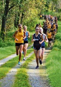 Lady Panther Julia Lockridge leads the team to victory during a match with Vilseck, Ansbach and Hohenfels at Hohenfels Oct. 4. Both the boys and girls cross-country teams are undefeated this year— Photo courtesy Patch High School. 