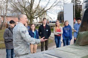 Photo by Robert WatsonAir Force Staff Sgt. Chad Welch of the Joint Communications Support Element from Tampa, Fla., describes the capabilities and characteristics of the HMWWV vehicle to students from Patch High School Feb. 28 during a partnership learning event that was coordinated by EUCOM’s C4 and Cyber Operations Directorate.