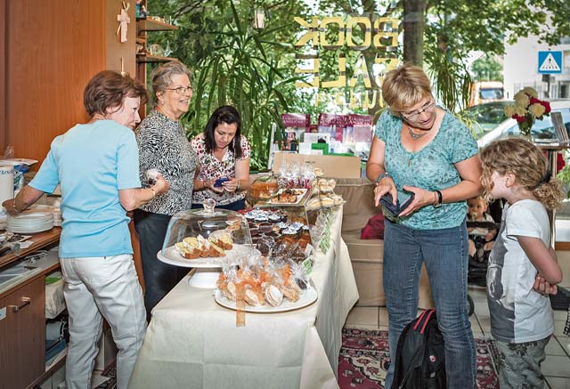 James PalikVisitors purchase baked goods at the St. Catherine’s Anglican Church book and bake sale during the last “American Days” in Stuttgart. This year, the sale will be held May 17 from 9:30 a.m. to 5 p.m. Patrons can find an array of English books and can also indulge in baked goods and coffee.