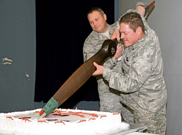 Photo by SOCEUR Public AffairsThe senior U.S. Air Force service members in U.S. Special Operations Command Europe, Col. Ben McMullen and Master Sgt. Jeffery Jordan, ceremonially cut the cake using an old airplane prop during the 59th SOCEUR Establishment Day ceremony. Establishment Day is an annual event hosted by SOCEUR to celebrate its inception and history.