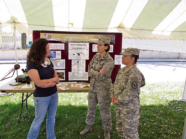 Photo by U.S. Africa Command Public AffairsMichelle Sanders, a malaria survivor (from left to right), Air Force Lt. Col. Pamela Ward-Demo and Army Lt. Col. Sueann Ramsey from the Command Surgeon’s Office, talk about World Malaria Day. U.S. Africa Command observed World Malaria Day April 25 on Kelley Barracks to help spread awareness of the disease to members of the AFRICOM community.
