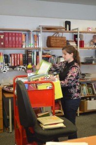 Cassie Schreiber, sorts books for reshelving at the Patch Library.  