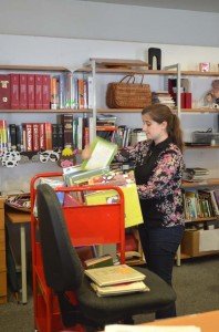 Cassie Schreiber, sorts books for reshelving at the Patch Library.