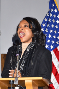 Family member Raquel Sargent sings the national anthem to start the Martin Luther King Jr. observance Jan. 9 in the Patch Chapel. Photo by S.J. Grady, USAG Stuttgart Public Affairs Office.