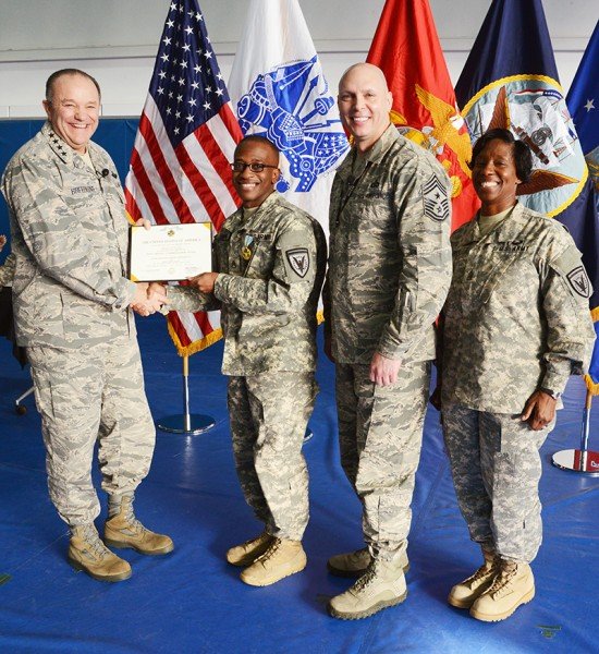 EUCOM Commander Gen. Philip M. Breedlove presents Staff Sgt. Marvin A. Hannah, EUCOM's Mid-Level Service Member of the Year with a Joint Service Commendation Medal. Photo by Adam Sanders.