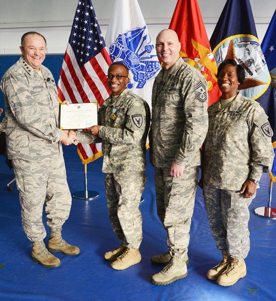 EUCOM Commander Gen. Philip M. Breedlove presents Staff Sgt. Marvin A. Hannah, EUCOM's  Mid-Level Service Member of the Year   with a Joint Service Commendation Medal.  Photo by Adam Sanders. 