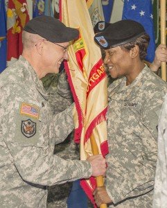 Col. Glenn K. Dickenson, USAG Stuttgart garrison commander, returns the unit’s colors to Command Sgt. Maj. Lynice D. Thorpe, USAG Stuttgart, during the USAG Stuttgart Change of Command ceremony Feb. 27 at Patch Fitness Center, Patch Barracks, Stuttgart, Germany. Photo by Greg Jones, USAG Stuttgart Public Affairs.