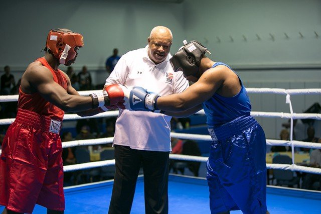 Xavier Kelley (red) and Edwin Francois (blue) both of Stuttgart, prepare to square off in the final bout of the evening. Photos by Virginia Kozak, special to the Citizen--Photo by Virginia Kozak, special to the Citizen.