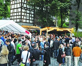 Visitors enjoy food, drinks and company during a previous year's “Bohnenviertelfest” at Stuttgart’s historic bean quarter. The timbered building in the background is the “Schellenturm,” or “handcuff tower,” that was built in 1564 as part of the city fortification. The Schellenturm received its name from the “Schellenwerkern,” prisoners who had to fulfill their public service and wore leg irons to prevent them from escaping. Today, the Schellenturm houses a Swabian wine restaurant.