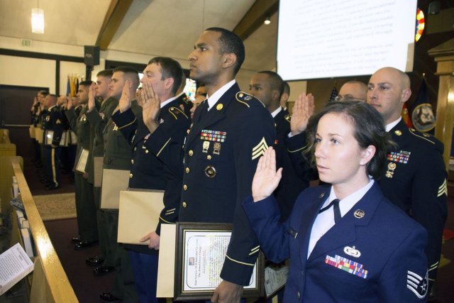 Noncommissioned officers recite the NCO charge at the first ever Stuttgart Joint Services Noncommissioned Officer Induction Ceremony April 30 at Patch Chapel, Patch Barracks, Stuttgart.