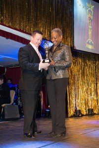 Brian Mitchell receives his Topper award for best male military performance in a musical from USAG Wiesbaden Commander Col. Mary Martin. All photos by Martin Greeson.