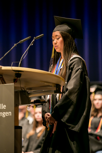 Sharmaine Poblete,  valedictorian, addresses the audience of families, friends and educators. Photo by Virginia Kozak, Patch High School. 