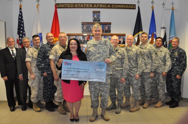 Ms. Adams & Gen Rodriguez (Commander SAFRICOM) are holding the check surrounded by AFRICOM's senior leadership. Photo credit: USAFRICOM Public Affairs Office (POC: Ms Brenda Law).