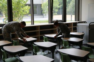 Photo Credit: Christopher Augsburger, USACE Army cadets Patrick Richardson and Melissa Hersey arrange desks July 22 in a classroom at the new Stuttgart Elementary School in Boeblingen, Germany. She and West Point cadet Patrick Richardson worked on furniture inspections and final project closeout items for the elementary and high school construction project during their summer assignment to U.S. Army Corps of Engineers Europe District's Stuttgart Resident Office.