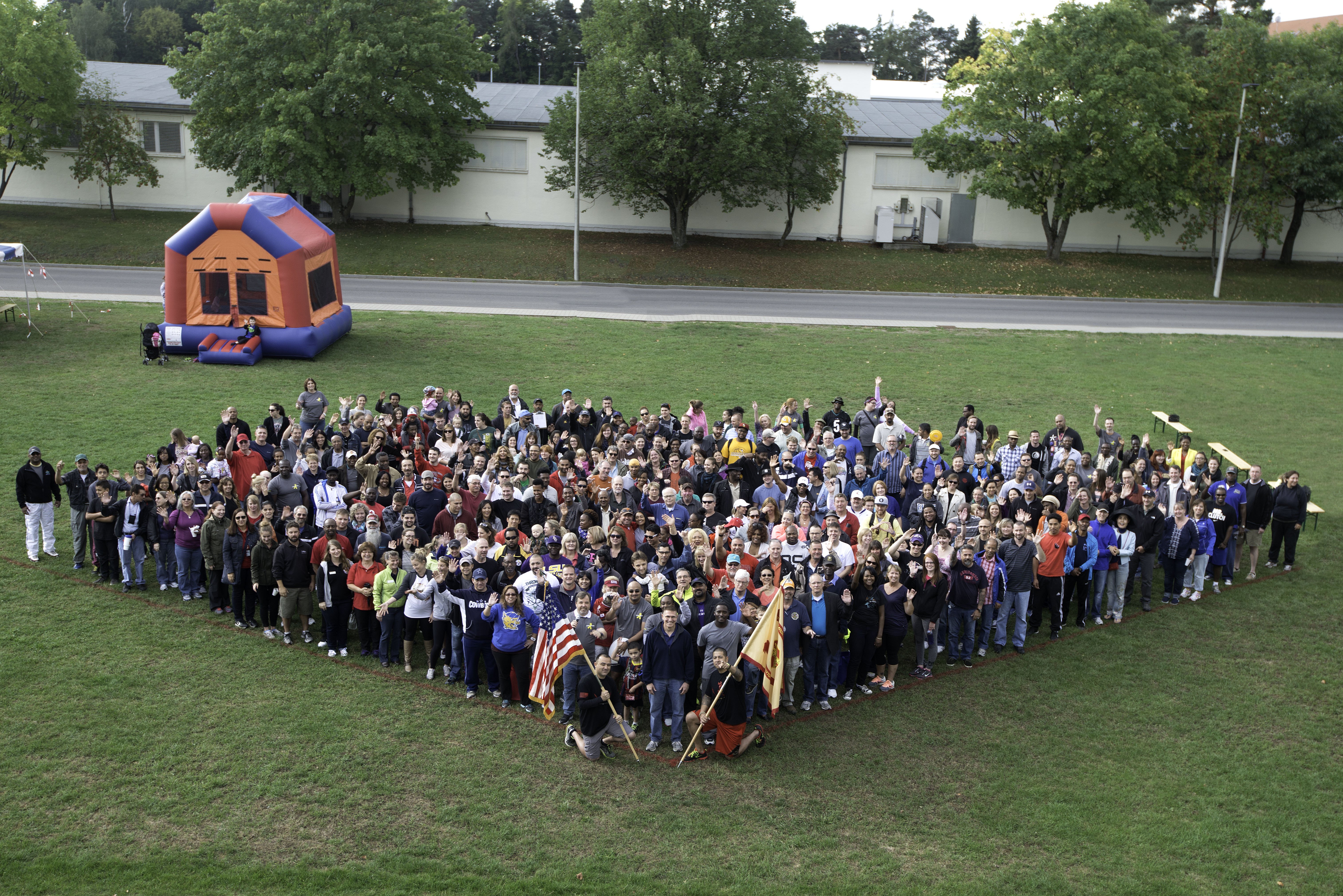 U.S. Army Garrison Stuttgart workforce gathers for a group shot at the 2015 Organization Day Sept. 4. - U.S. Army Photo by Martin Greeson.
