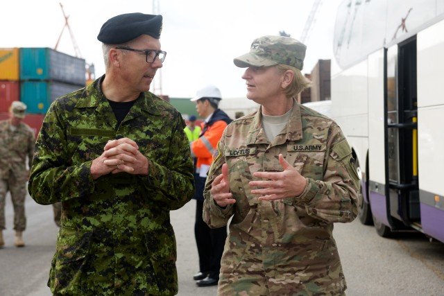 Col. Laura Loftus (right), the Deputy Chief of Staff, Engineer, speaks with Canadian Commodore Marcel Hallé, the Assistant Chief of Staff at the Supreme Headquarters Allied Powers Europe, Sept. 3, at the port of Riga during the third day of the 21st TSC-led Sustainment Terrain Walk. Over the past few days, the entourage of approximately 80 senior leaders from around the European theater met with dozens of sustainers and logisticians who directly impact the flow of equipment and maintenance into and out of the European theater. (U.S. Army photo by Sgt. Daniel Cole, U.S. Army Europe Public Affairs)