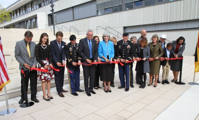 Officials from the Department of Defense Education Activity, U.S. Army Garrison Stuttgart, U.S. Army Corps of Engineers Europe District, and their German government design and construction partners cut the ribbon Sept. 18 on the new Stuttgart elementary and high schools at Panzer Kaserne in Boeblingen, Germany. USACE Europe District managed the $98 million project. Photo Credit: Vince Little, USACE.