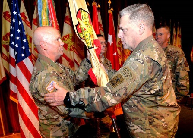 Chief of Staff of the Army Gen. Mark Milley passes the U.S. Army Installation Management Command guidon to Lt. Gen. Kenneth Dahl during a change of command ceremony Nov. 3 at the Fort Sam Houston Theatre in San Antonio. (U.S. Army IMCOM photo by Tim Hipps, IMCOM Public Affairs)