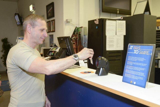 U.S. Army Brig. Gen. Donald C. Bolduc, Special Operations Command Africa commander, swipes in at Patch Fitness Center, Feb. 2. The swipe is tabulated in the U.S. Army Garrison Stuttgart Family and Morale, Welfare and Recreation system to provide data for future decisions and funding for Stuttgart fitness centers. Photo by Kevin S. Abel. 