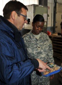 Photo Credit: Mr. Gino G Mattorano (Army Medicine) Gerald Fasching, a supervisory quality inspection specialist, and Spec. Keturah Branch, a veterinary food inspection specialist, perform a spot check on food arriving at the Kaiserslautern Cold Storage Facility March 3. Spot checks ensure that food items have remained at correct temperatures during transport. Fasching and Branch are both assigned to Public Health Command Europe.