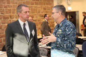 Dave Colberg, left, a U.S. Army Corps of Engineers Europe District program manager, discusses an issue with Navy Capt. Rod Worden, chief of AFRICOM's Logistics Support and Engineering Division, during the USACE Partner Workshop. The sixth annual forum took place Feb. 17 at Clay Kaserne in Wiesbaden, Germany.