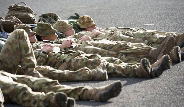 PEARL HARBOR (July 6, 2012) Australian marines sleep alongside the amphibious assault ship USS Essex (LHD 2) before training evolutions with Kingdom of Tonga, Indonesian, and U.S. Marines and Canadian soldiers. Twenty-two nations, more than 40 ships and submarines, more than 200 aircraft and 25,000 personnel are participating in RIMPAC exercise from June 29 to Aug. 3, in and around the Hawaiian Islands. The world's largest international maritime exercise, RIMPAC provides a unique training opportunity that helps participants foster and sustain the cooperative relationships that are critical to ensuring the safety of sea lanes and security on the world's oceans. RIMPAC 2012 is the 23rd exercise in the series that began in 1971. (U.S. Navy photo by Mass Communication Specialist 2nd Class Eric Crosby/Released)