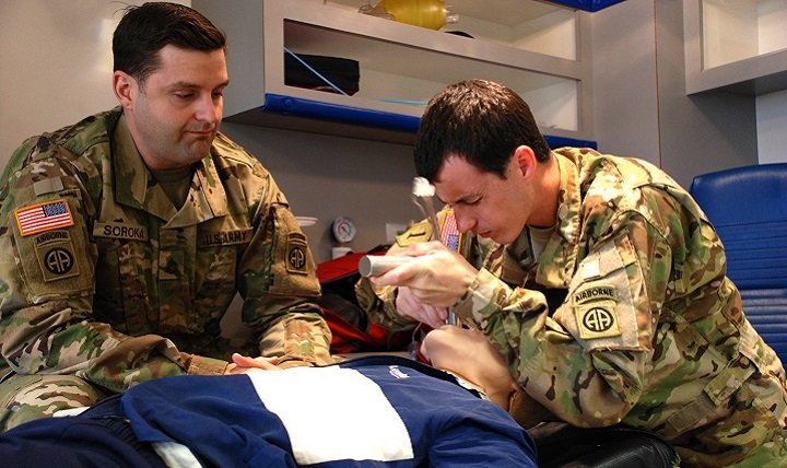 Staff Sgt. James Soroka, left, and Sgt. Brandon Dukes, both medics assigned to the 82nd Combat Aviation Brigade practice endotracheal intubation, March 3, 2016. Both Soldiers are attending paramedic training at Fayetteville Technical Community College to obtain the paramedic certification they need to remain flight medics. (U.S. Army photo by Eve Meinhardt/WAMC PAO)