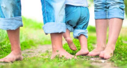 feet in grass spring barefoot park