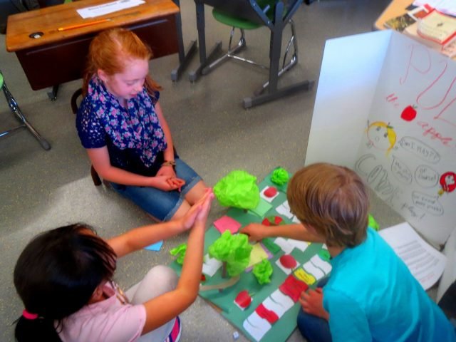 Stuttgart Elementary School third grader, Codie Williams shares her original game, "Under the Sea" with other third grade students from one of the many classrooms who were invited to play. Photo Credit: Daniel L'Esperance.