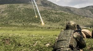 A German soldier serving with the Multinational Battle Group-East and Kosovo Force, watches as a flare illuminates a set of simulated targets during Operation Sharp Griffin May 6, 2016 at Orahovac Range in Kosovo. Photo Credit: Staff Sgt. Thomas Duval.