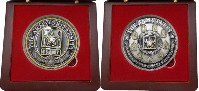 Both sides of Army University's Army Press coin for noncommissioned officer writing excellence is shown. The winner of the program's competition each quarter will receive this encased coin and a personal note from the Army University Provost, Brig. Gen. John S. Kem. (Photo Credit: Courtesy)