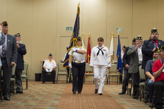 Yeoman 1st Class Brenda Belcher, a Washington native, assigned to AFRICOM in Stuttgart, Germany, walks down the aisle during the 4th annual American Legion Department of Washington Spirit of Service Award (SOSA) in Centralia, Washington, July 15. The SOSA is awarded to outstanding military professionals who are actively engaged in the community through volunteer projects. U.S. Navy photo by Mass Communication Specialist 2nd Class Jacob G. Sisco.