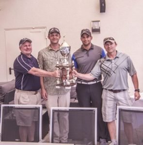 Team members of Special Operations Command Africa, (left to right) Bill Vasios, Richard Romine, John Childers and Shawn Kauffman, hold the winning trophy at the Commanders Cup Golf Tournament, Aug. 13, 2016 at the Stuttgart Golf Course in Kornwestheim. Photo by Severin Hardy.