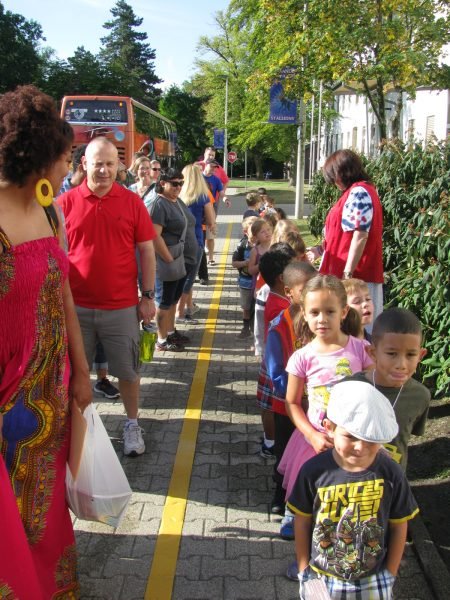 Soon-to-be kindergartners line up at Patch Elementary School with their parents in a separate line, to experience what a day at the new school will be like from the bus ride to the classroom, Sept. 2, 2016. Photo by 