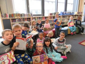 Heather Tibodeaux's kindergarten class read books together in the library of Stuttgart Elementary School dressed in pajamas joined the rest of Stuttgart Elementary School in recognizing Red Ribbon Week by dressing up in their favorite PJ's and wearing them to school, Oct. 24. Red Ribbon Week has been recognized since 1985 in remembrance of Enrique Camarena who died in the line of duty fighting the use of drugs in America. Every day this week, students pledge remain drug free in a different and creative way. Photo by Daniel L'Esperance