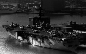 The USS Guam (LPH-9), an Iwo Jima-class amphibious assault ship, shown dockside in Barcelona Harbor following the accident, Jan. 30, 1977. The Guam was decommissoned in 1998 and served as a target for a SINKEX, Oct. 16, 2001. Photo by Fabio Pena.