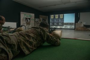 U.S. Soldiers train using the Engagement Skills Trainer II (EST II) at the Panzer Range Complex near Böblingen, Germany, May 10, after a recent upgrade from the older version EST 2000. The EST II provides greater accuracy, higher quality graphics, expanded tutoring capabilities and will allow for greater number of lanes. EST supports ground combat readiness as the Army’s virtual Basic Rifle Marksmanship training system. U.S. Army Photo by Visual Information Specialist Martin Greeson. 