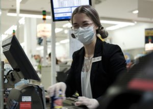 a commissary teller, scans a customer's purchased products