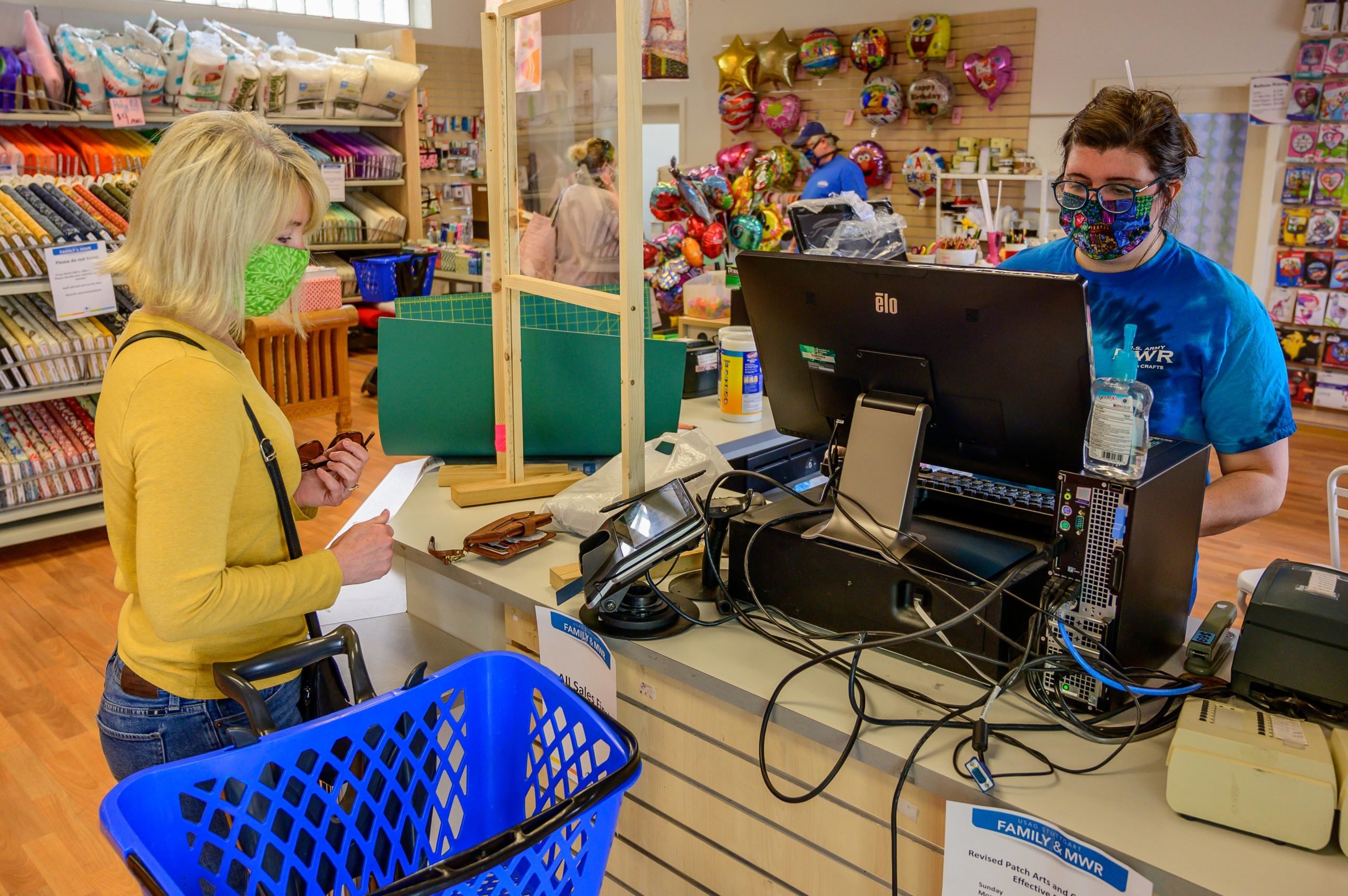 A customer buys art supplies at the Arts and crafts center