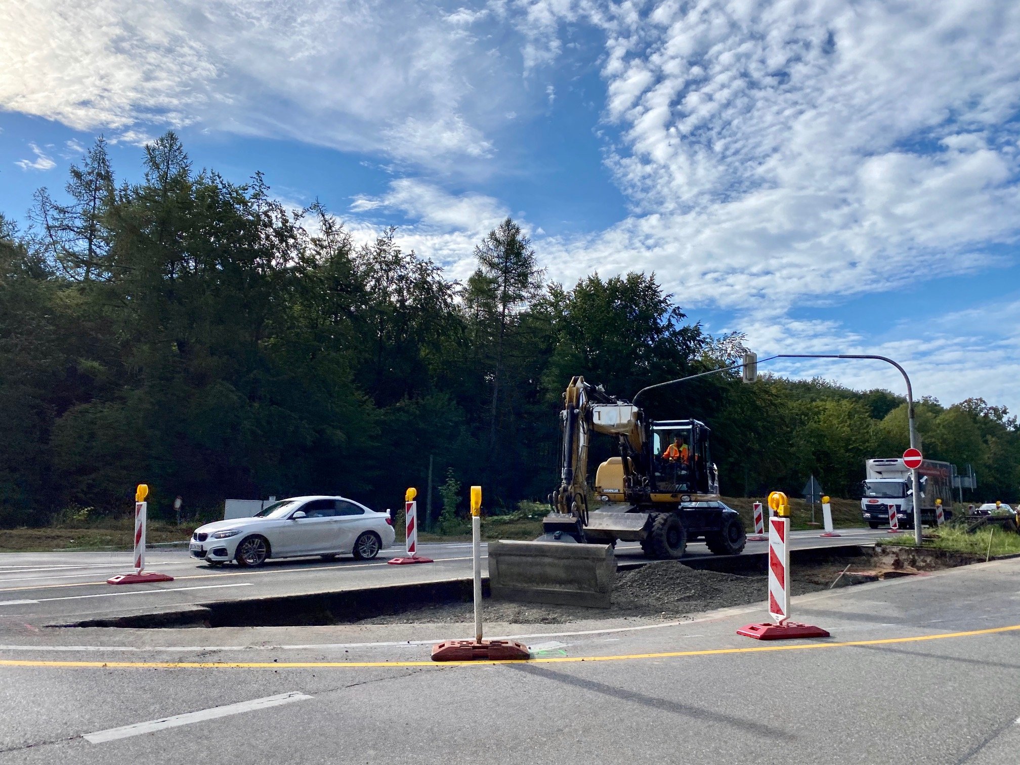 A digger positioned in the middle of a construction area