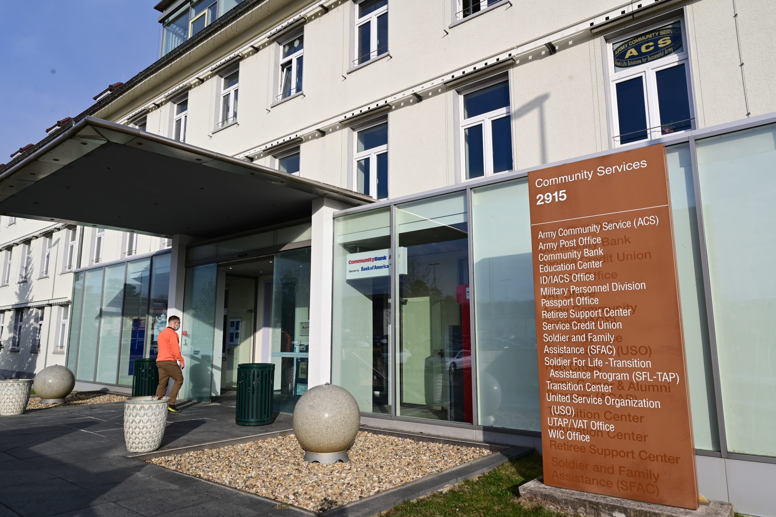 shows members of the stuttgart community entering ing entering the community services building